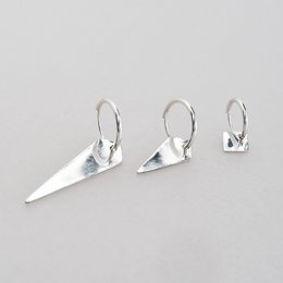 Sterling silver, 24k gold plated statement earrings in large, medium, and small sizes. Geometric, triangular shape with a sharp, pointed design.