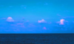 Serene painting depicting a tranquil ocean scene with a calm, blue horizon and soft, wispy clouds in the sky.