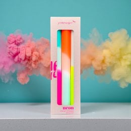 Vibrant, dip-dyed candles in a variety of neon colors including pink, yellow, and orange. The candles have a unique, rainbow-inspired design.