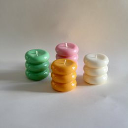  Tall, round pillar candles in a variety of pastel colors including cream, olive green, turquoise, mint green, rose, yellow, and orange.