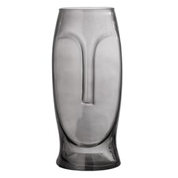 Grey glass vase with abstract face-like design.