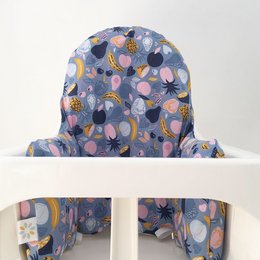 Colorful patterned high chair cover with abstract shapes and floral designs. Made of soft, durable fabric suitable for baby highchairs.