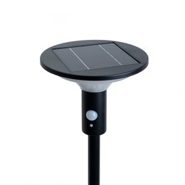 Tall black solar-powered LED floor lamp with round light fixture on top.