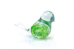 Decorative green glass bird figurine with bubble-like texture and iridescent finish.