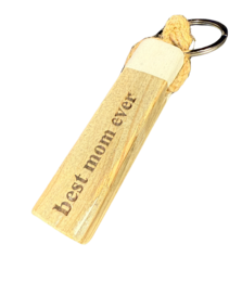 Wooden keychain with "Best mom ever" text and a dolphin design, suitable for mothers or as a gift.