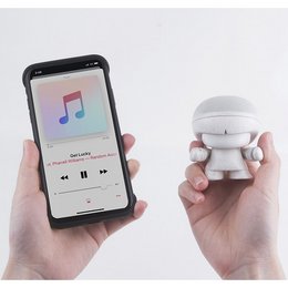 A compact, eco-friendly Bluetooth speaker in a variety of colors including white, orange, red, blue, and black. The speaker features a minimalist, rounded design and is suitable for use with smartphones.