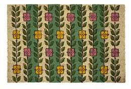 A decorative coir doormat featuring a repeating pattern of green leaves and colorful flowers in shades of pink, yellow, and orange.