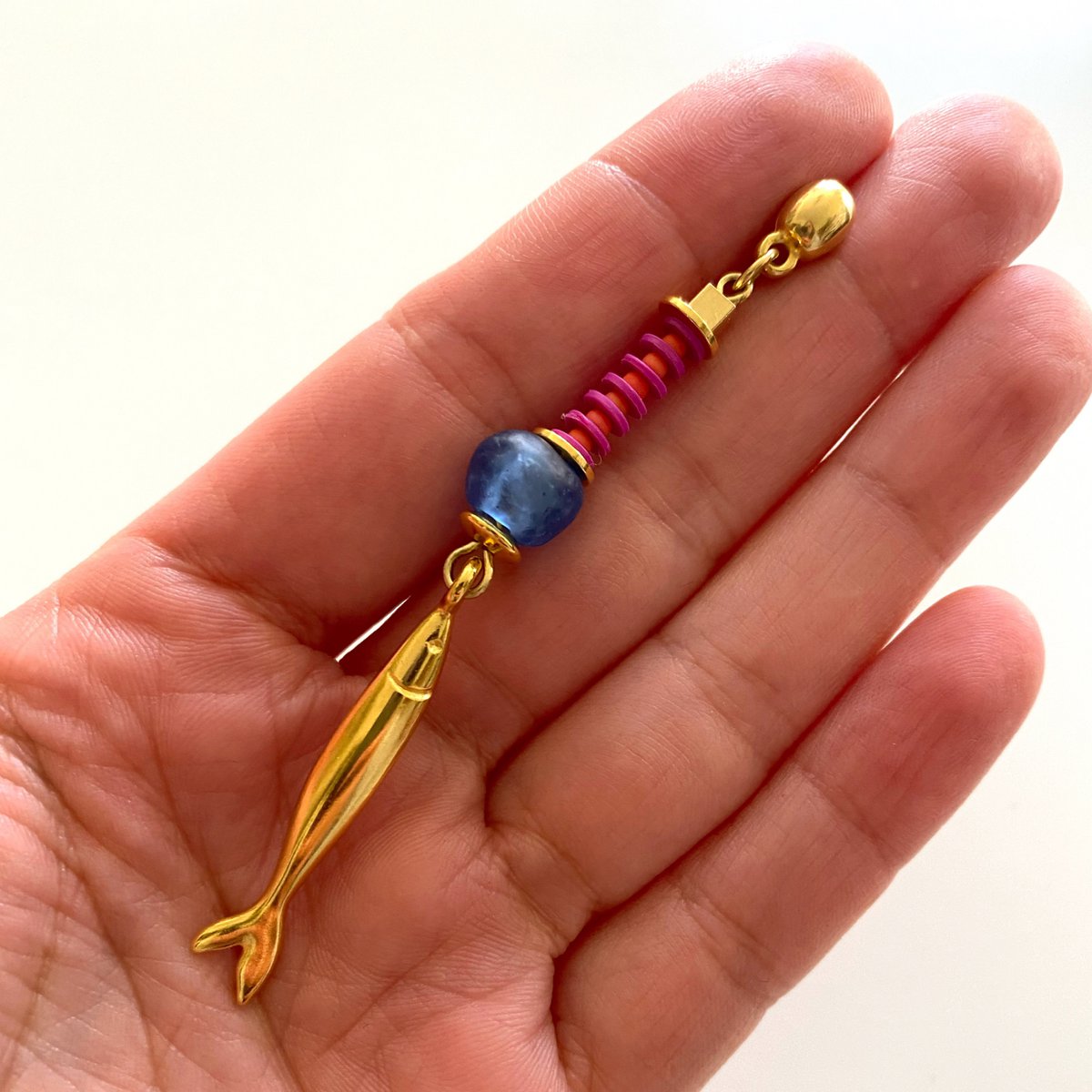 ARACATACA colorful golden earrings with fish pendants