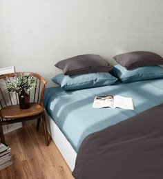  Two blue cotton percale pillowcases in 50x70cm and 65x65cm sizes.