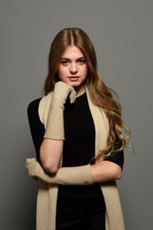 Beige cashmere gloves with a classic, minimalist design. Made from soft, high-quality cashmere material for warmth and comfort.