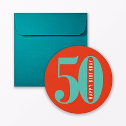 A round birthday card with the number "50" in large text on an orange background, enclosed in a teal envelope.