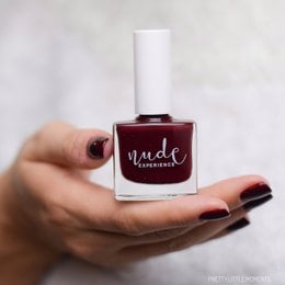 Dark burgundy nail polish with a glossy finish. Suitable for formal or casual wear.