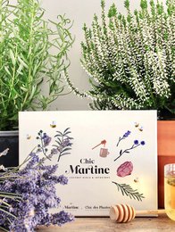 Infusions Box - "Chic Martine" Honeys, a collection of artisanal honey products featuring a floral and botanical design. The box contains various honey varieties in a rustic, natural presentation.