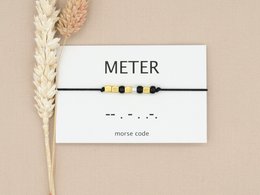 A silver, rose gold, and gold Morse code bracelet meter with beige, silver, rose gold, and gold color variants.

The Morse code bracelet meter is a stylish and minimalist accessory that features a simple design with a Morse code pattern. It is available in a variety of color options, including silver, rose gold, and gold, making it a versatile choice for any outfit. The bracelet is made of high-quality materials and is designed to be comfortable and durable.