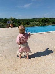 Soft, cozy kids' bathrobes in a variety of contemporary colors and styles, perfect for the beach, pool, or everyday wear.