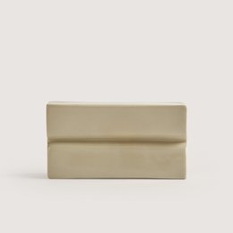  Rectangular beige soap dish made of ceramic material with a simple, minimalist design.