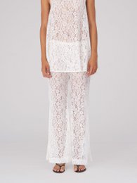  White lace pants with a sleeveless lace top. Elegant and feminine style.