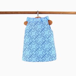 A blue and white patterned dress with a floral design. The dress has a sleeveless design and a round neckline.