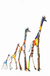  Colorful metal giraffe sculpture, featuring a tall, elongated shape with vibrant, abstract patterns and textures. Suitable for use as a decorative garden or outdoor accent piece.