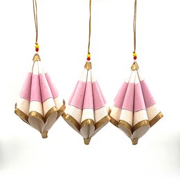 Set of 3 pink and gold folded paper ornaments with natural accents.