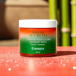  Exfoliating body scrub with green tea and mandarin scent. Jar contains guava-based formula.