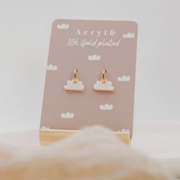 Cloud-shaped acrylic earrings with 18k gold plating.