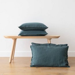Linen cushion cover in balsam green with terra fringe, available in various sizes including 30x40cm, 30x50cm, 40x60cm, and more. Decorative pillow with natural, textured linen material.