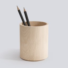 Wooden desk organizer with a cylindrical shape, suitable for storing pens, pencils, and other office supplies.