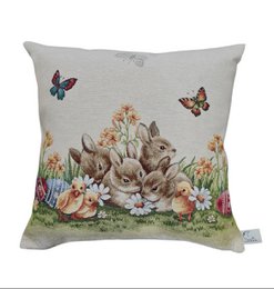  Decorative cushion cover featuring a colorful floral and rabbit design with butterflies. The cushion cover is made of gobelin fabric and is suitable for Easter or spring decor.