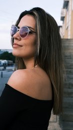 Round, purple-tinted sunglasses with silver metal frames.