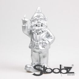  A silver-colored garden gnome statue with a long beard, wearing a hat and holding a staff. The gnome has a mischievous expression and is part of the Stoobz design collection.