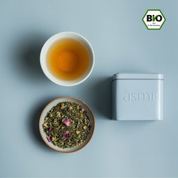 Relaxing herbal tea with chamomile and rose petals, packaged in a modern, minimalist container.