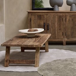  Rectangular wooden coffee table with sturdy angled legs in a rustic farmhouse style.