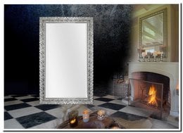 Silver framed mirror in a modern living room with a fireplace and checkered floor.