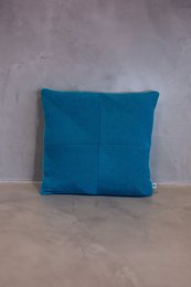 Teal blue square cushion cover made of soft, textured fabric. Suitable for living room, bedroom, or outdoor seating areas.