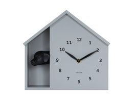Gray house-shaped wall clock with peeking dog design, cute animal silhouette, modern minimalist style.