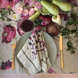  Linen napkin with blossom garden print, featuring a floral and botanical design in shades of pink, purple, and green.