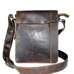 Brown waxed leather shoulder bag or crossbody bag with a large flap and magnetic closure.
