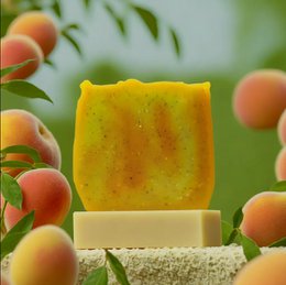 Peach and maracuja exfoliating soap bar, orange in color with a peach scent. Made with natural ingredients.