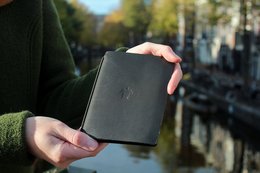 A black, hardcover notebook with the title "NOTE A6" printed on the cover.