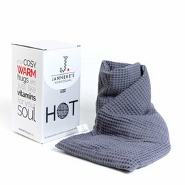 Gray waffle-textured organic linseed beauty gift set with cozy warm blanket.