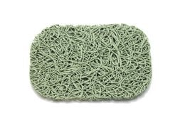 A green woven soap dish made of natural materials.