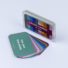 Colorful mood cards in a compact case, designed for self-care, mindfulness, and wellbeing. The cards feature a variety of vibrant patterns and textures, encouraging users to reflect on their emotional state.