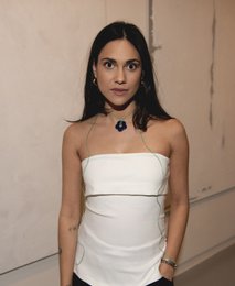  A delicate blue flower pendant necklace with a simple, elegant design. The necklace features a vibrant blue flower pendant on a thin, adjustable cord that can be worn in a variety of styles.