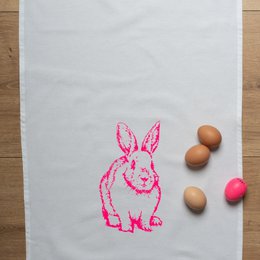 Vintage-style pink bunny tea towel, made of cotton, with a neon pink design.