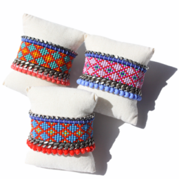 Colorful beaded ethnic bracelet with intricate patterns and textures.