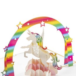 A pop-up card featuring a magical unicorn surrounded by a colorful rainbow arch and sparkling stars. The card is made of gold-colored material with a white unicorn design.