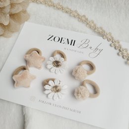  Soft, natural-looking hair ties in neutral tones. Made from high-quality, durable materials for a comfortable, secure hold.