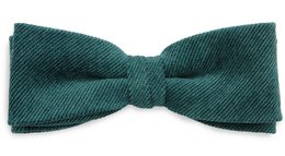 Emerald green corduroy bow tie with a classic style and texture.