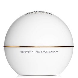Rejuvenating face cream in a white jar with gold trim. Designed to revitalize and nourish the skin.